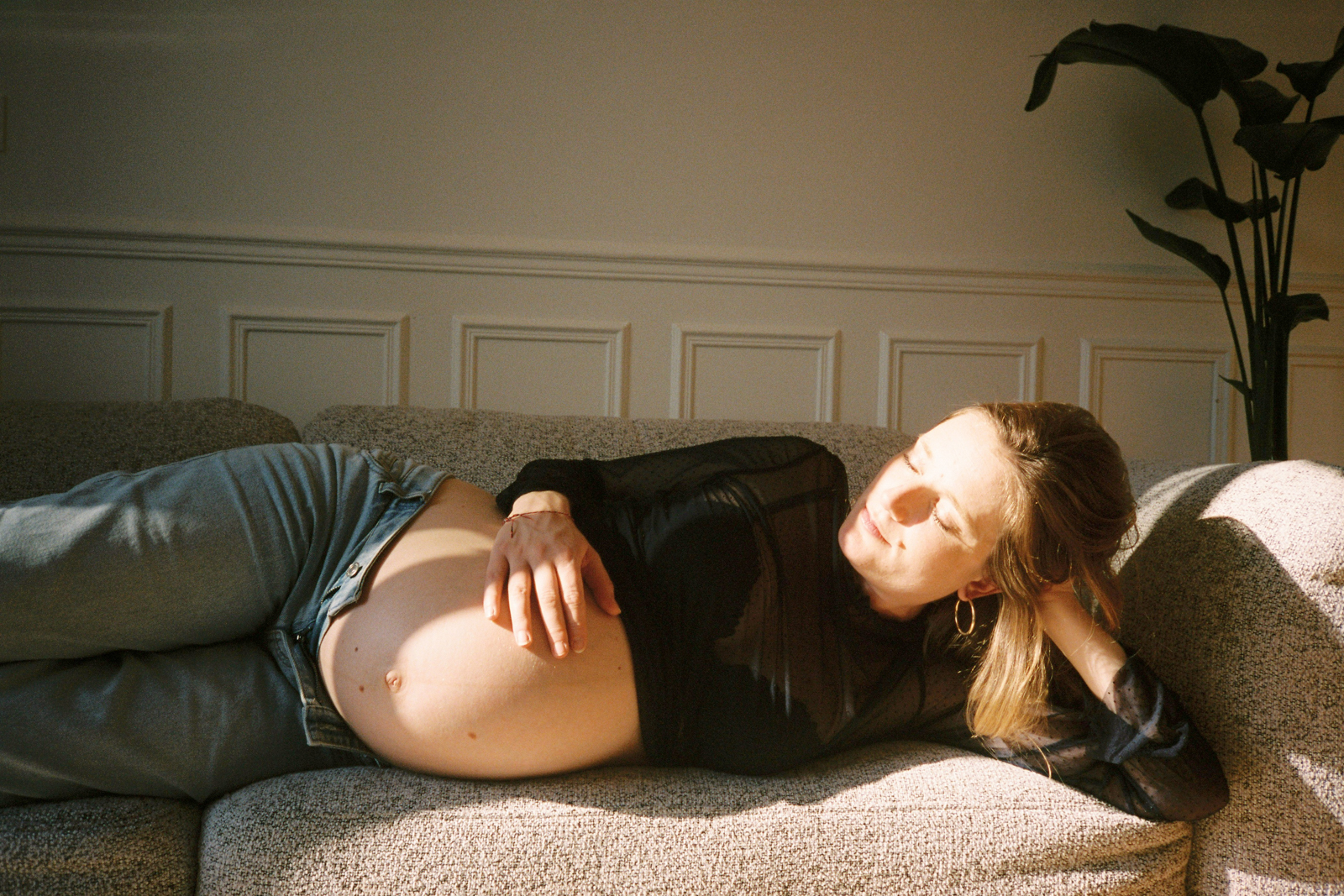 golden light baby bump pregnant couch